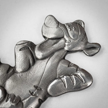 Metallic bear figurine on a white background