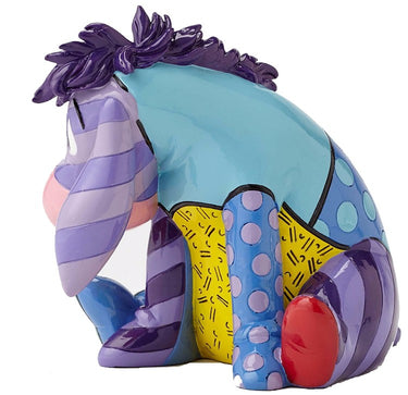 Colorful ceramic zebra figurine with abstract patterns on a white background