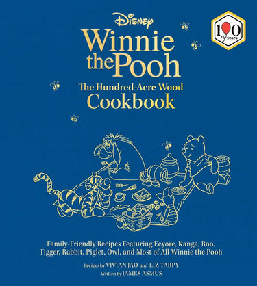 Cookbook cover of 'Winnie the Pooh: The Hundred-Acre Wood Cookbook' with illustrations of characters on a blue background.