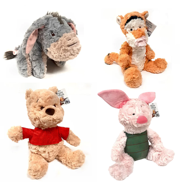 A collection of four plush toy figures, including a bear and animal characters in soft colors.