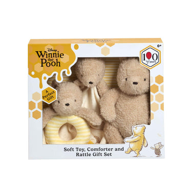 Winnie the Pooh soft toy, comforter, and rattle gift set packaging on a white background
