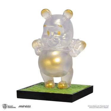 Translucent Pooh figure with gold accents on a green base, featuring the Beast Kingdom logo.
