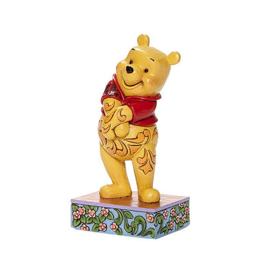 View of Jim Shore's Disney Traditions Beloved Bear Personality Pose figurine