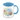 A ceramic mug with an illustration of Winnie the Pooh and Piglet