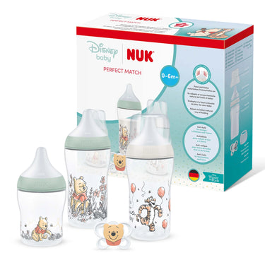 NUK baby bottles with Disney baby design in front of NUK packaging