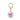 A gold-colored metal collar charm with a cartoon piglet design on a pink background with the text 'DISNEY'.