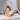 Girl cuddling Tigger Anniversary Plush
