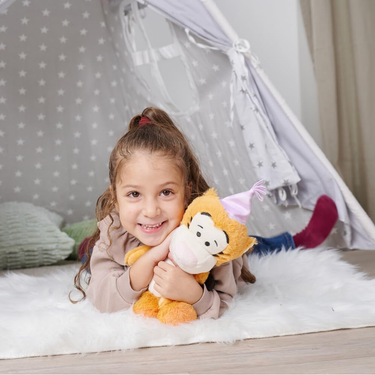 Girl cuddling Tigger Anniversary Plush