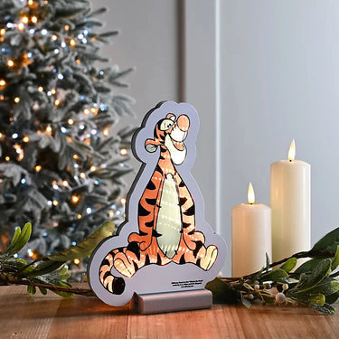 Tigger Infinity Light surrounded by Christmas decor