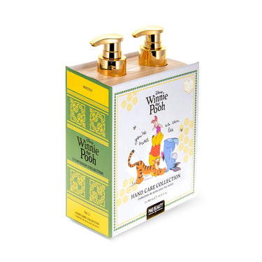 Winnie the Pooh hand care collection soap dispenser in a book-style box with gold pump dispensers, shown on a white background.