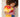 Child holding a plush toy with a heart on a carpeted floor