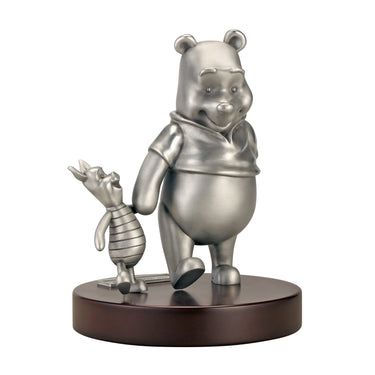 A pewter figurine of Winnie the Pooh and Piglet from the story, depicted in 3D with detailed expressions, walking off into the distance on a wood composite base stained a handsome walnut.