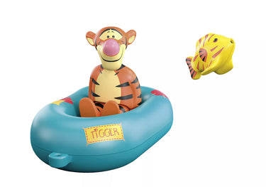 Tigger toy in a blue raft with a yellow fish on a white background