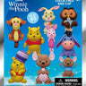 Packaging of Winnie the Pooh collectible bag clips with characters on a blue background