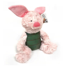 A plush toy resembling a piglet with pink fur, green overalls, and a pink nose.