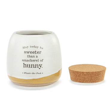 White container with cork lid featuring a Winnie-the-Pooh quote on a white background