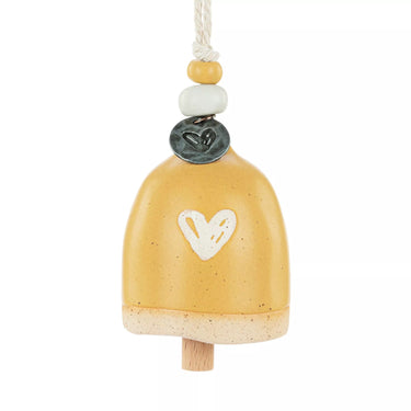 Decorative bell with a heart design on a white background