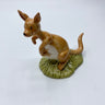 Ceramic kangaroo figurine on a white background