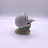 A figurine of Piglet from Royal Doulton, featuring a balloon. The figurine is hand-painted and posed with a balloon, commemorating the 70th anniversary of Winnie the Pooh.