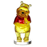 A figurine of Winnie the Pooh character, made of acrylic with a yellow and red color scheme, presented in a clear window box packaging.