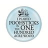 A round blue button badge with text and an illustration of Winnie-the-Pooh.