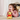 Child playing with a Winnie the Pooh plush toy on a carpeted floor.