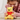 Child holding a small Winnie the Pooh plush toy with a red shirt.