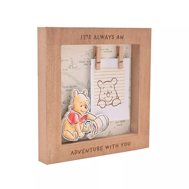 Wooden frame with a Pooh Bear design and text 'It's always an adventure with you' on a white background.