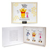 Winnie the Pooh hand cream collection gift set by Mad Beauty, featuring a white and gold illustrated box cover with Pooh and Piglet, plus an open inner box displaying three hand cream tubes with character illustrations.