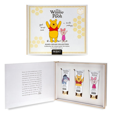 Winnie the Pooh hand cream collection gift set by Mad Beauty, featuring a white and gold illustrated box cover with Pooh and Piglet, plus an open inner box displaying three hand cream tubes with character illustrations.
