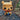 Funko Pop! vinyl figure of a bear character sitting on a wooden log with a natural background.