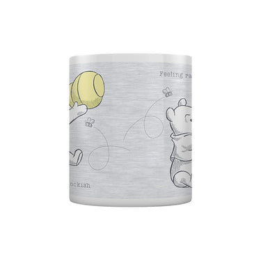 White mug with cartoon bear design and text on a white background